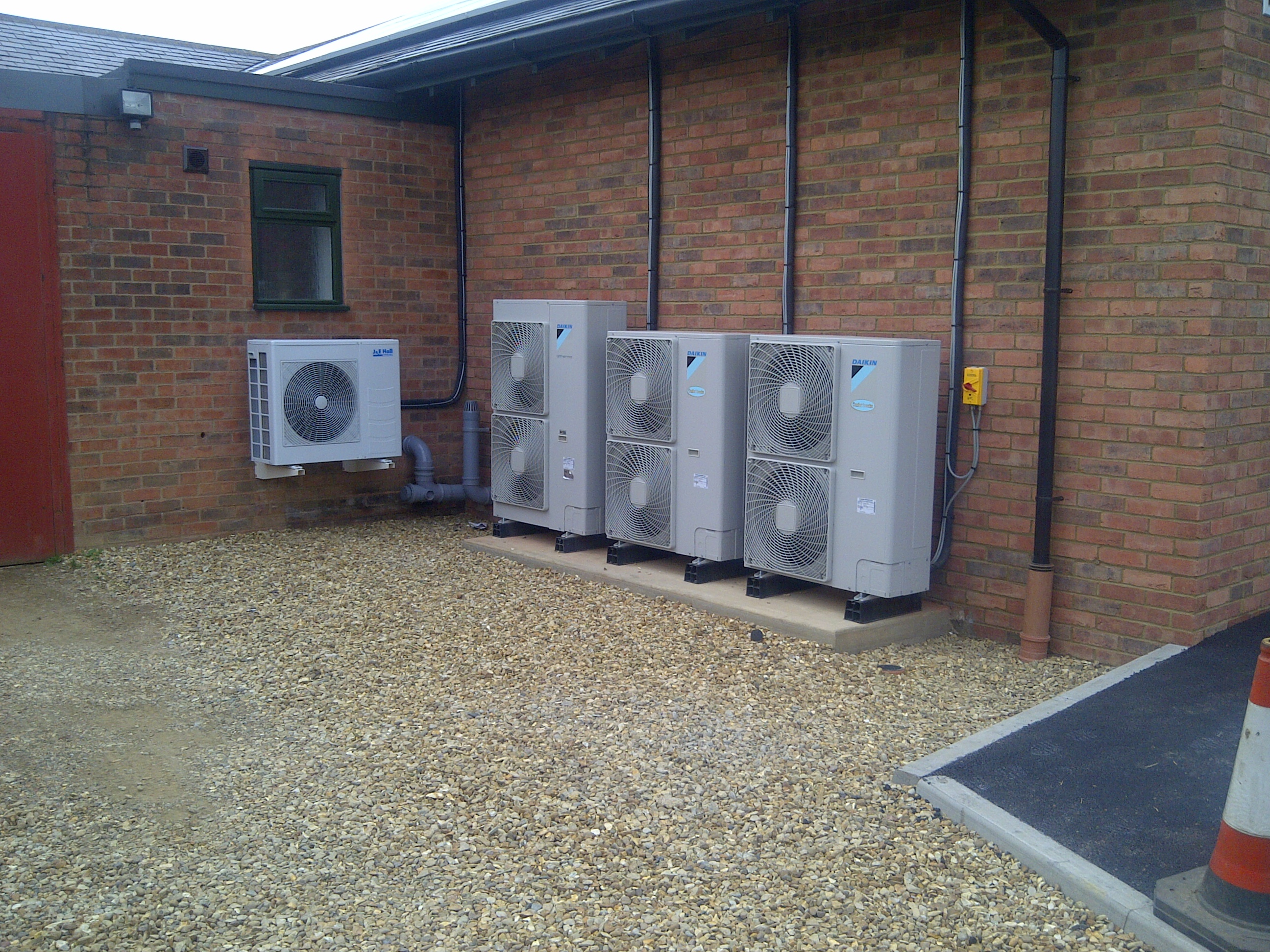 Tidy row of Daikin air conditioning condensors