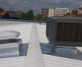 Roof mounted evaporative cooler with extract fan
