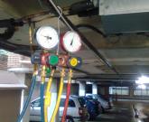 Refrigerant leak testing and regassing