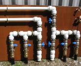 Externally wall mounted ground collector manifold